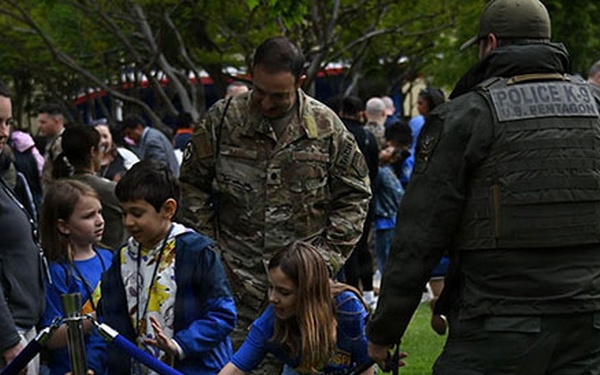 A PFPA K-9 and handler at a job fair