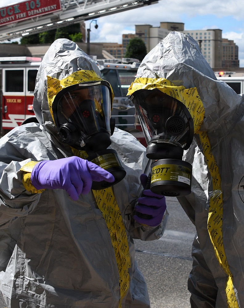 Chemical, Biological, Radiological, and Nuclear (CBRN) specialists in safe suits during a training exercise