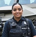 A Pentagon police officer poses in front of an armored vehicle