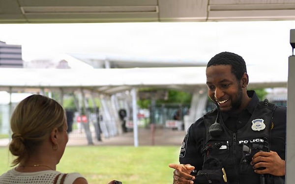 A Pentagon officer checks for proper ID for building entry