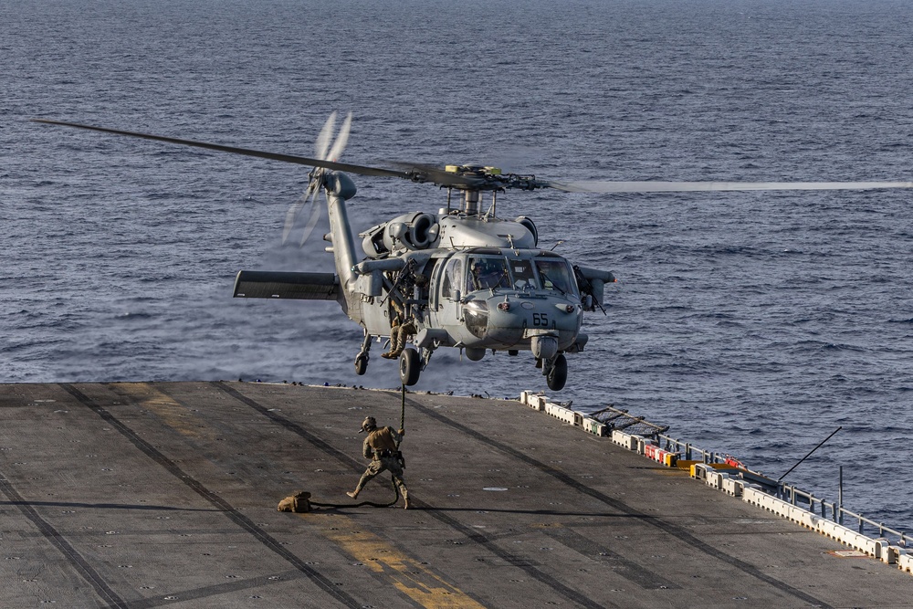 U.S. Marines Conduct a Fast Rope Evolution aboard the USS Iwo Jima