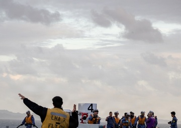 U.S. Marines, Sailors and JMSDF members carry out a flight deck operation rehearsal