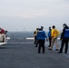 U.S. Marines, Sailors and JMSDF members carry out a flight deck operation rehearsal