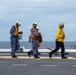 U.S. Sailors and JMSDF members conduct flight operations aboard the JS Kaga