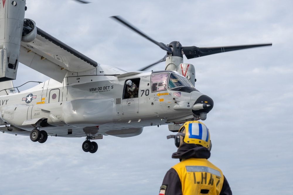 U.S. Sailors and JMSDF members conduct flight operations aboard the JS Kaga
