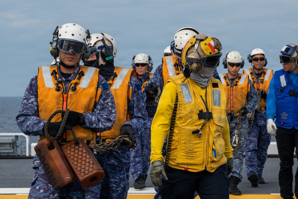 U.S. Sailors and JMSDF members conduct flight operations aboard the JS Kaga
