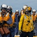 U.S. Sailors and JMSDF members conduct flight operations aboard the JS Kaga
