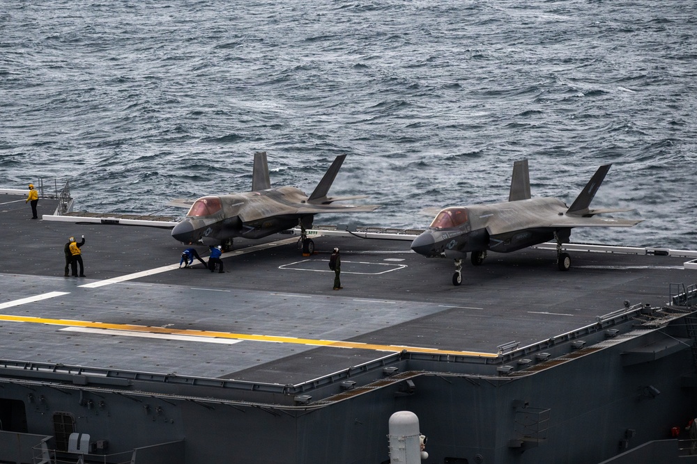 U.S. Marines, Sailors and JMSDF members conduct flight operations aboard the JS Kaga