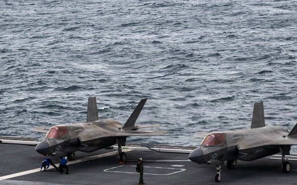 U.S. Marines, Sailors and JMSDF members conduct flight operations aboard the JS Kaga