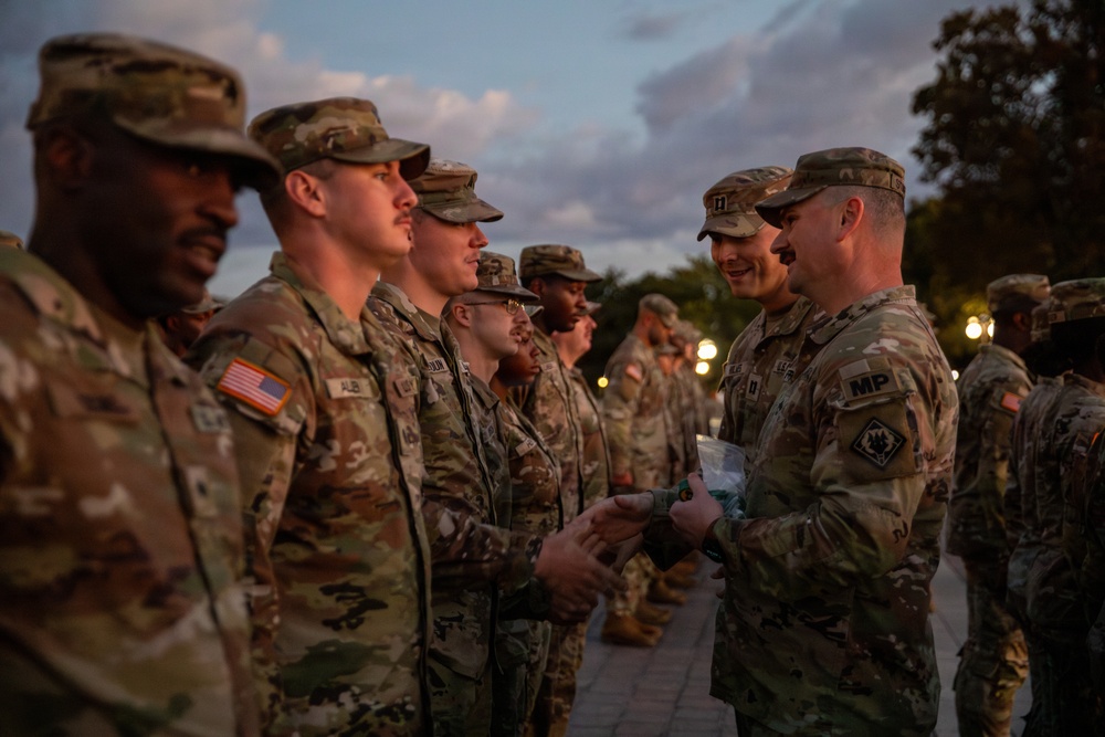 Mississippi National Guard service members receive coins during a promotion ceremony in front of the U.S. Capitol