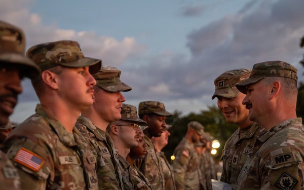 Mississippi National Guard service members receive coins during a promotion ceremony in front of the U.S. Capitol