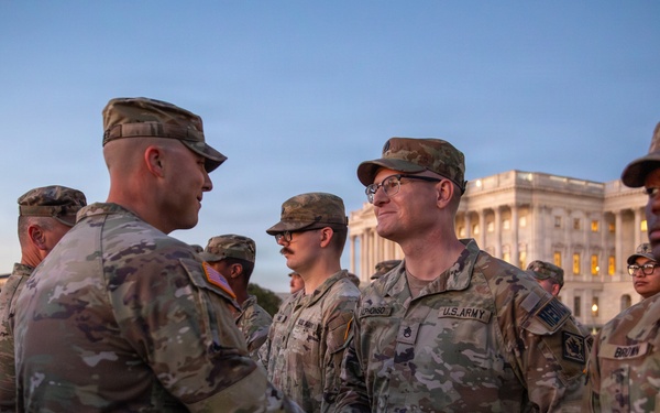 Mississippi National Guard service members receive coins during a promotion ceremony in front of the U.S. Capitol