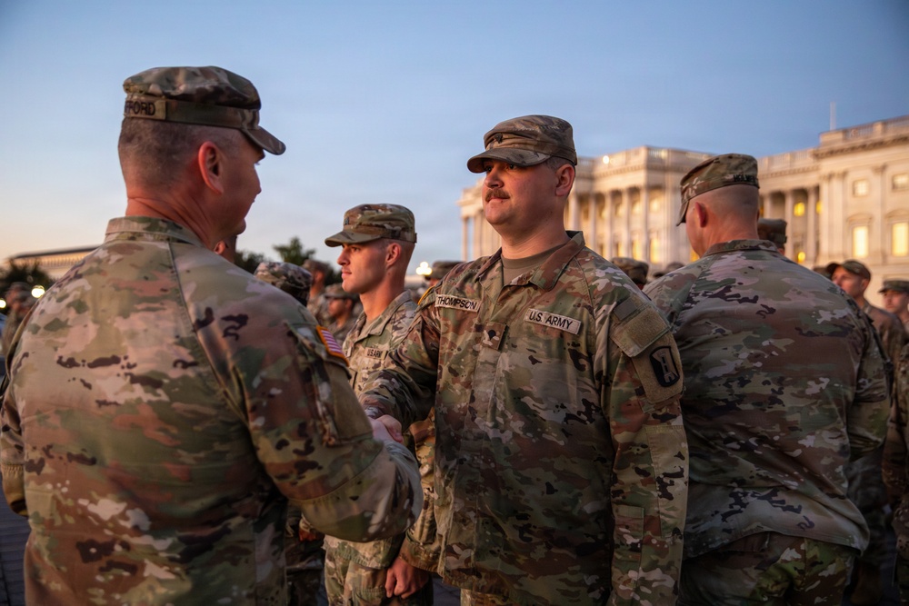 Mississippi National Guard service members receive coins during a promotion ceremony in front of the U.S. Capitol
