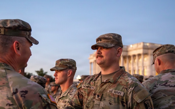 Mississippi National Guard service members receive coins during a promotion ceremony in front of the U.S. Capitol