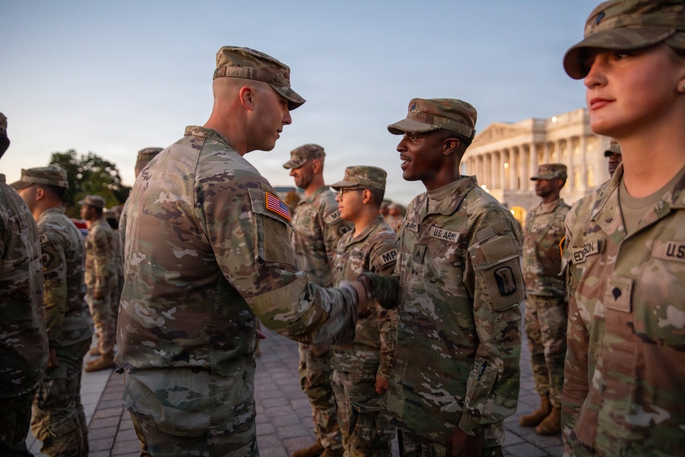 Mississippi National Guard service members receive coins during a promotion ceremony in front of the U.S. Capitol