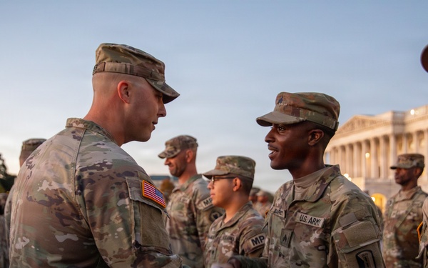 Mississippi National Guard service members receive coins during a promotion ceremony in front of the U.S. Capitol