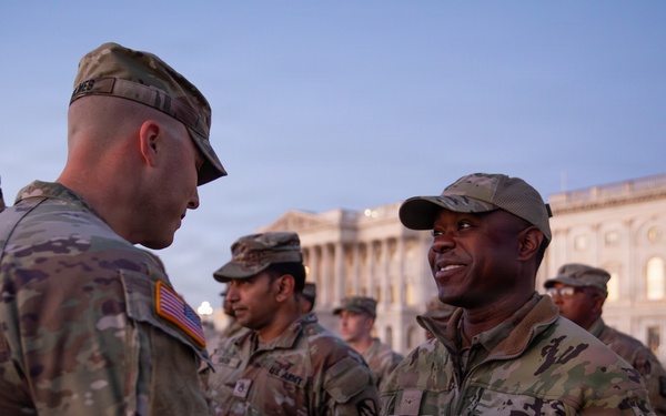 Mississippi National Guard service members receive coins during a promotion ceremony in front of the U.S. Capitol