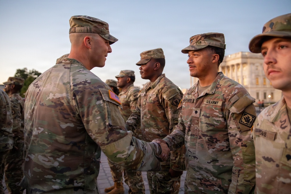 Mississippi National Guard service members receive coins during a promotion ceremony in front of the U.S. Capitol