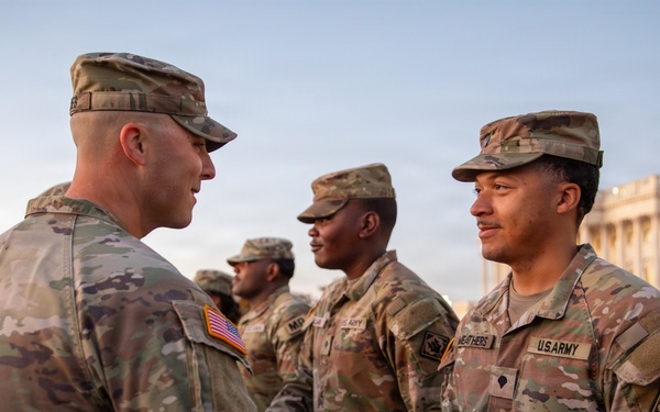 Mississippi National Guard service members receive coins during a promotion ceremony in front of the U.S. Capitol