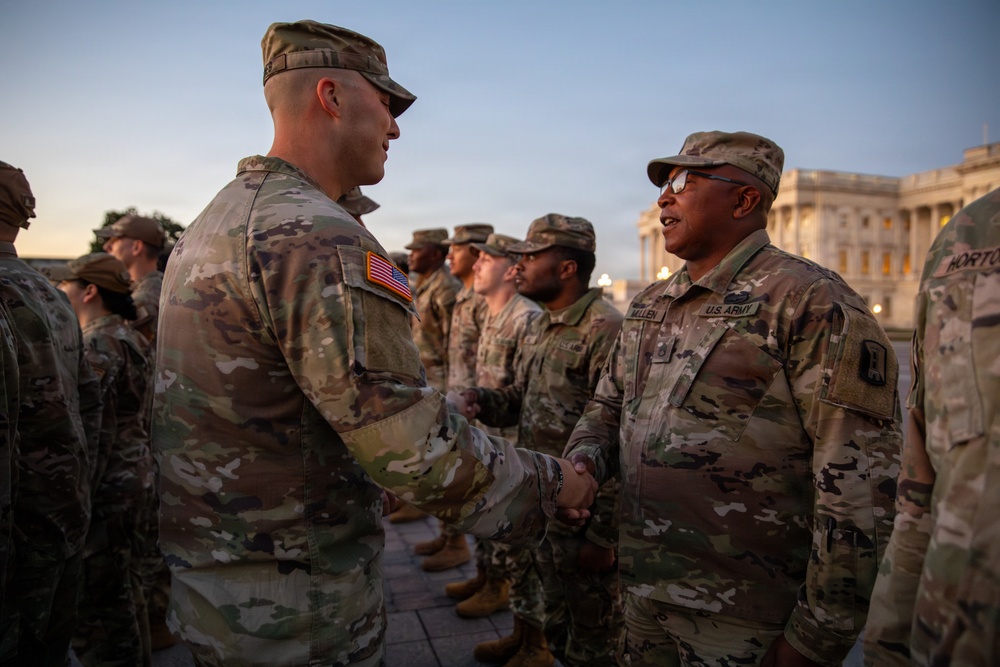 Mississippi National Guard service members receive coins during a promotion ceremony in front of the U.S. Capitol
