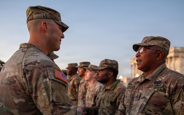Mississippi National Guard service members receive coins during a promotion ceremony in front of the U.S. Capitol