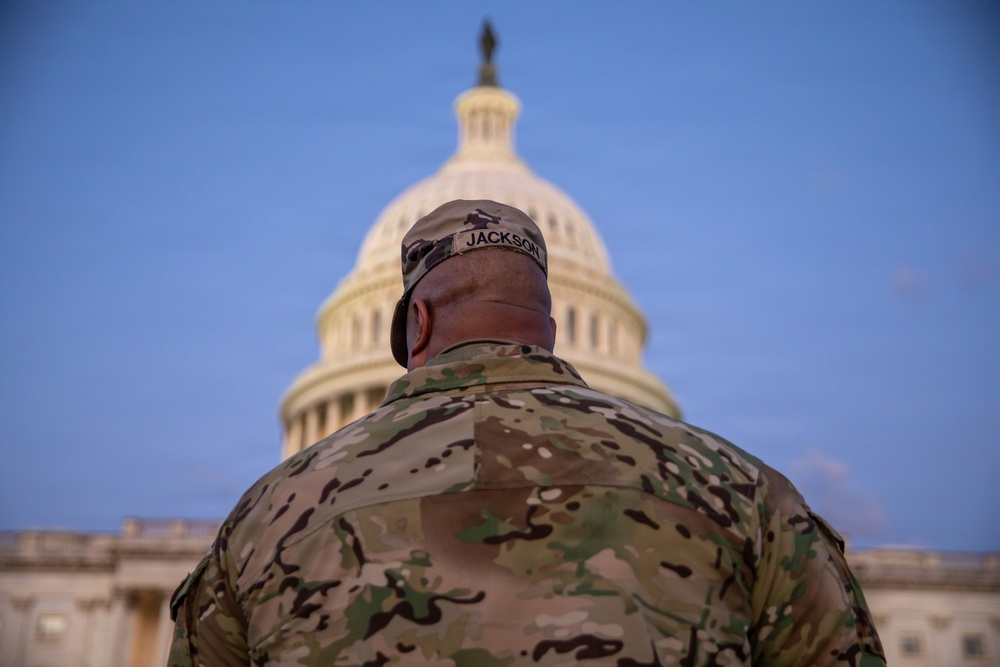 Lt. Col. Steven Jackson talks to service members during a promotion ceremony in front of the U.S. Capitol