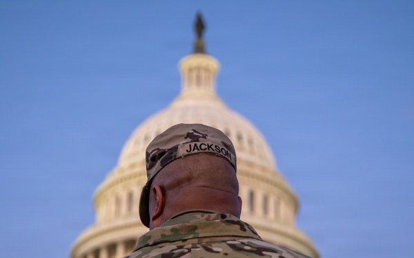 Lt. Col. Steven Jackson talks to service members during a promotion ceremony in front of the U.S. Capitol