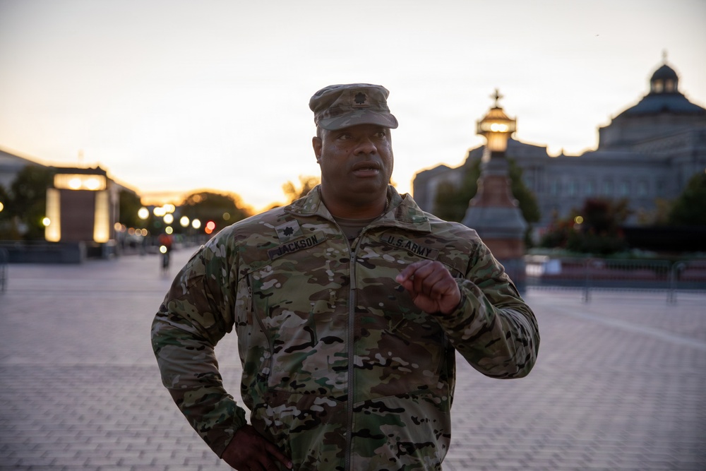 Lt. Col. Steven Jackson talks to service members during a promotion ceremony in front of the U.S. Capitol