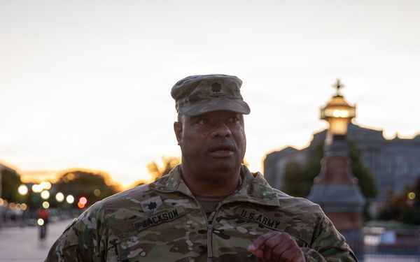 Lt. Col. Steven Jackson talks to service members during a promotion ceremony in front of the U.S. Capitol
