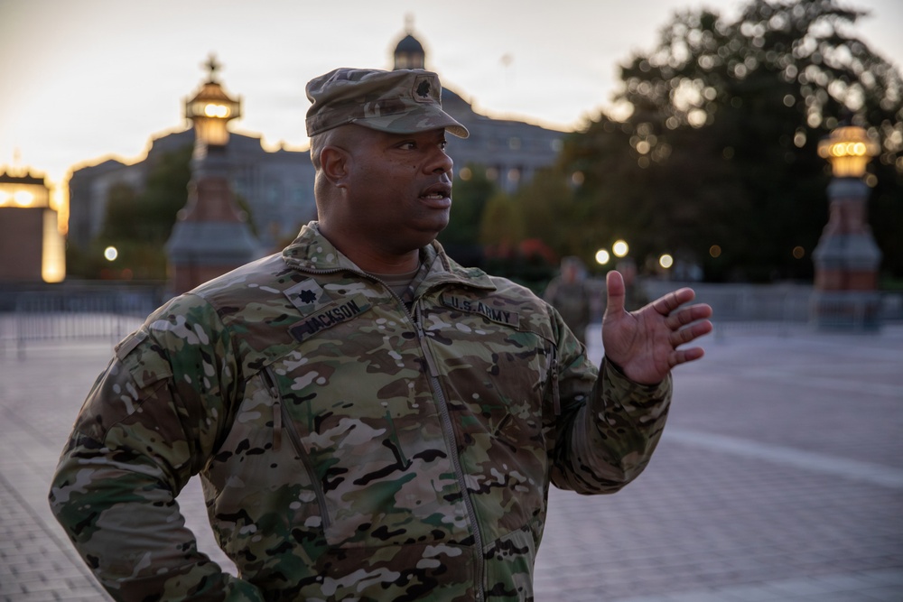 Lt. Col. Steven Jackson talks to service members during a promotion ceremony in front of the U.S. Capitol