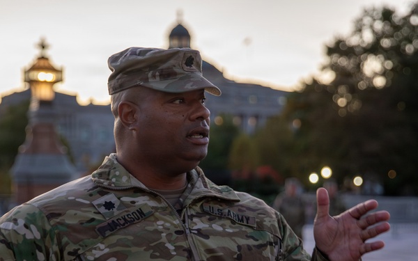 Lt. Col. Steven Jackson talks to service members during a promotion ceremony in front of the U.S. Capitol