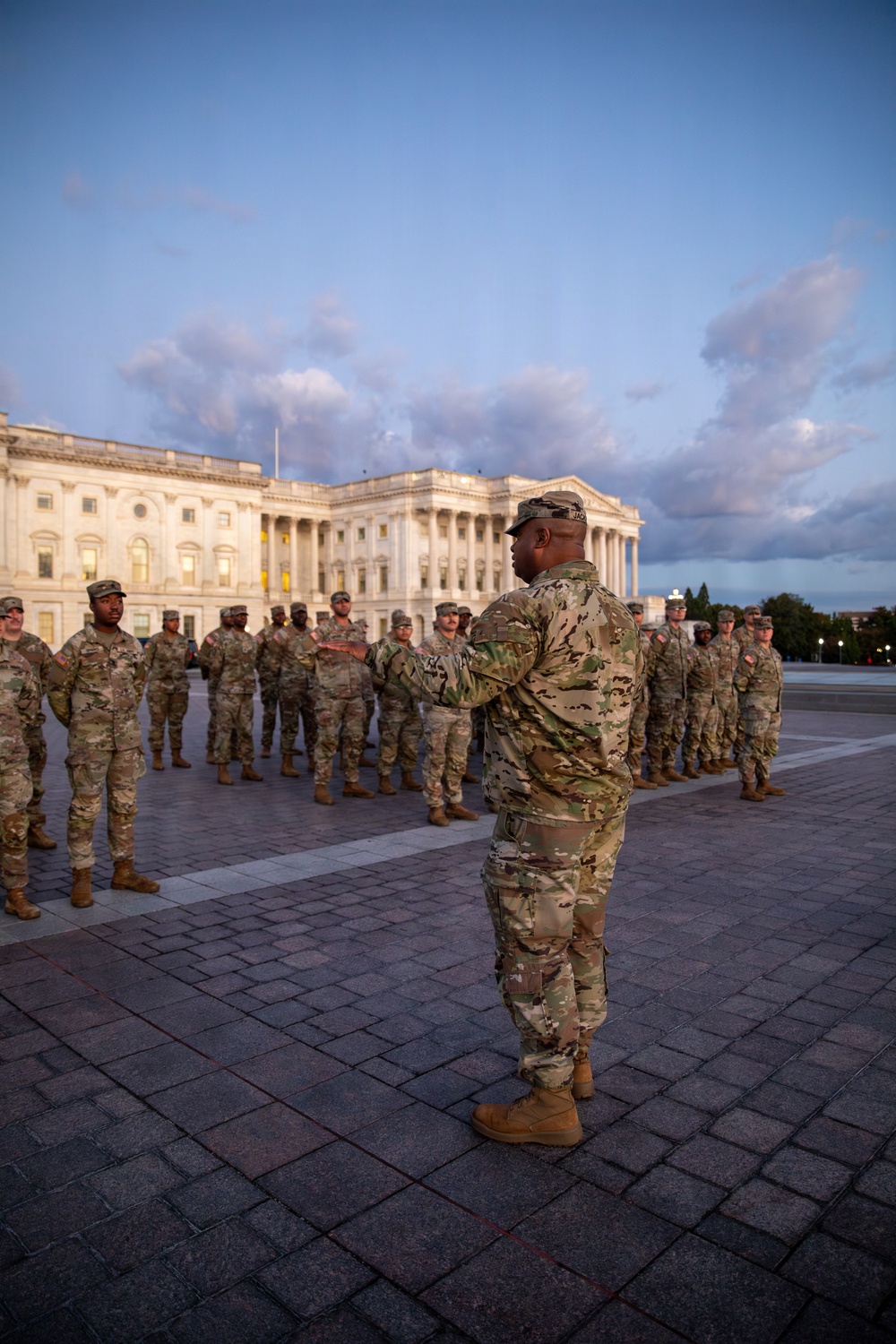 Lt. Col. Steven Jackson talks to service members during a promotion ceremony in front of the U.S. Capitol
