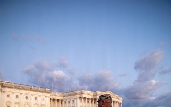 Lt. Col. Steven Jackson talks to service members during a promotion ceremony in front of the U.S. Capitol