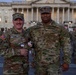 Lt. Col. Steven Jackson takes a picture with a Soldier in front of the U.S. Capitol