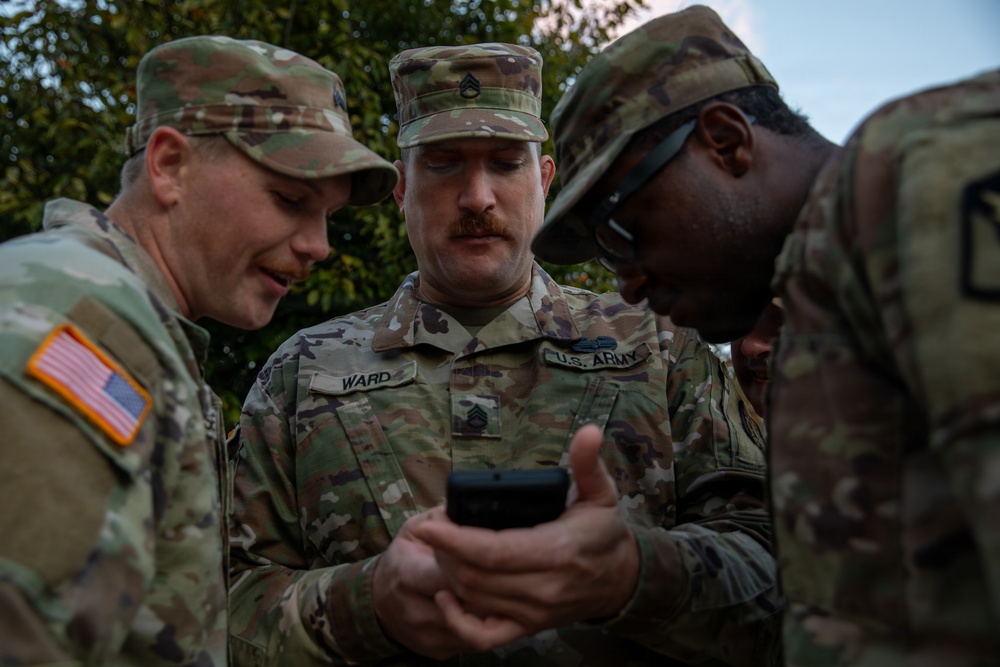 Mississippi Army National Guard Soldiers look at a phone in Washington, D.C.