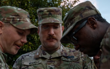 Mississippi Army National Guard Soldiers look at a phone in Washington, D.C.
