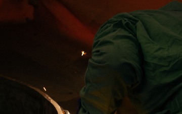 Ronald Reagan Sailors Work With Contractors to Prepare the Mast and Island