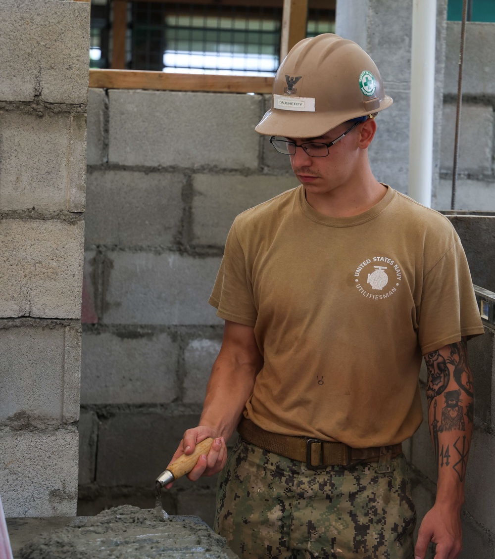 Naval Moblie Construction Battalion (NMCB) 4 conducts repairs at Maagiagi Elementary School
