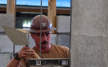Naval Moblie Construction Battalion (NMCB) 4 conducts repairs at Maagiagi Elementary School