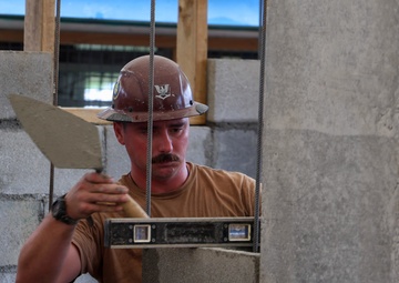 Naval Moblie Construction Battalion (NMCB) 4 conducts repairs at Maagiagi Elementary School
