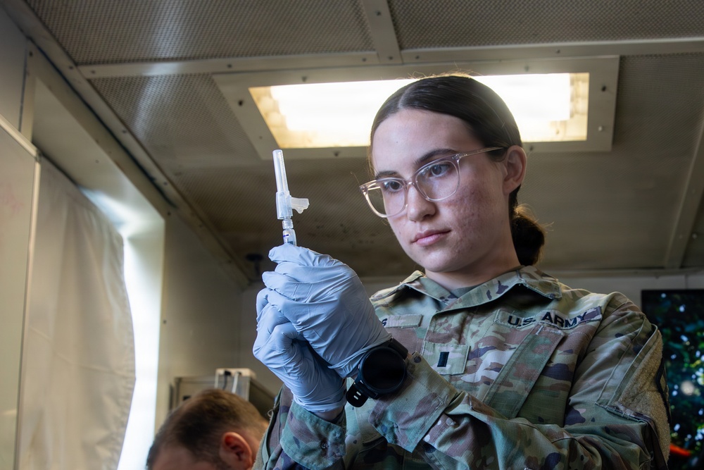 Combat medic specialist administers flu vaccinations