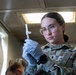 Combat medic specialist administers flu vaccinations
