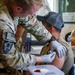 Combat medic specialist administers flu vaccinations