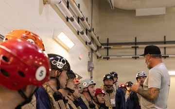 U.S. Marines with MWCS-28 dive into Underwater Egress Training