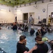 U.S. Marines with MWCS-28 dive into Underwater Egress Training
