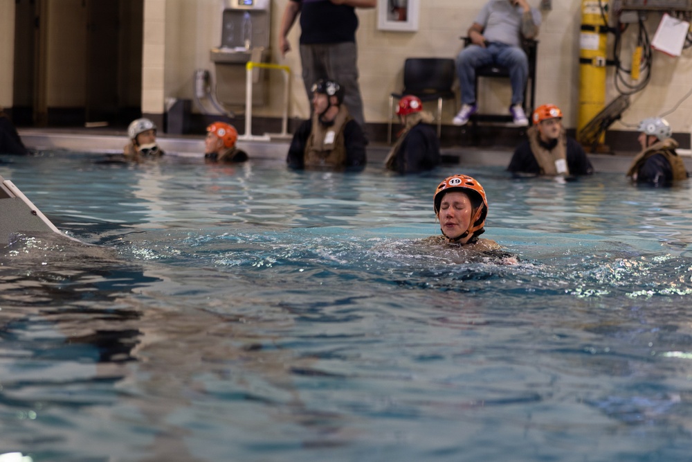 U.S. Marines with MWCS-28 dive into Underwater Egress Training