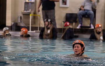 U.S. Marines with MWCS-28 dive into Underwater Egress Training