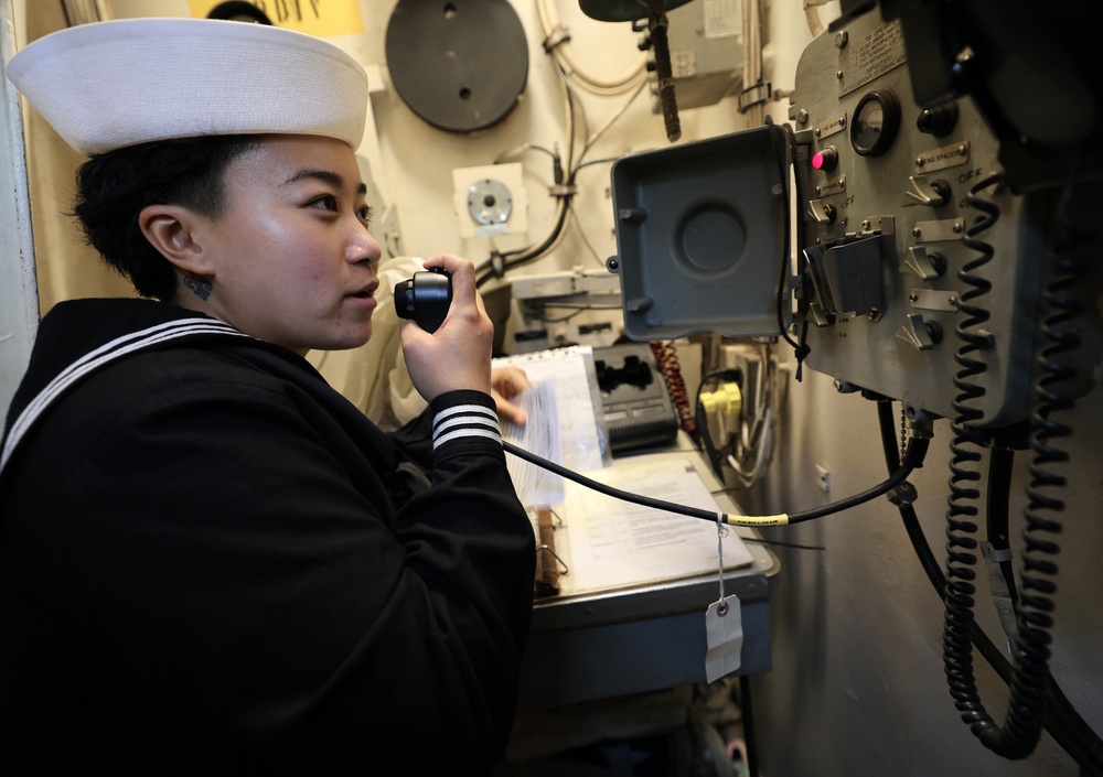 USS Roosevelt (DDG 80) Sailor Stands Quarterdeck Watch