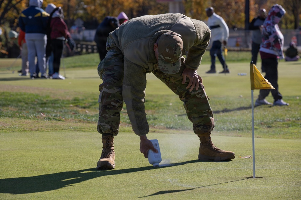 Airmen helps set up local golf course