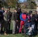 Soldiers pose for photo with children participating in Special Olympics program